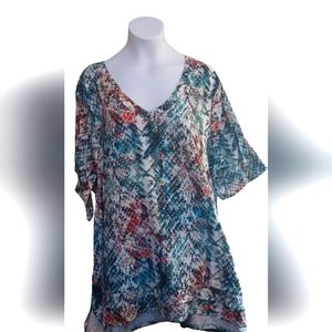 Life Style Woman Multi-Colored Short Sleeve Top, with Ruffled Bottom.
